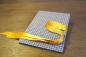 Preview: Mini photo book for 14 photos, blue and white, small graphic stars, yellow satin ribbon